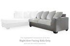 Right-facing sectional sofa with gray upholstery, ribbed cushions, and three back pillows