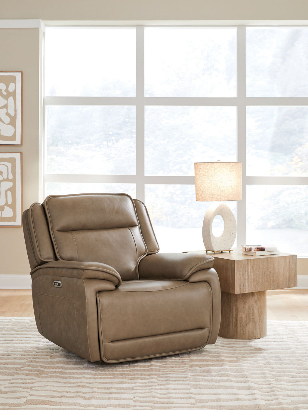 Brown power recliner chair with adjustable headrest and smooth recline design, angled view
