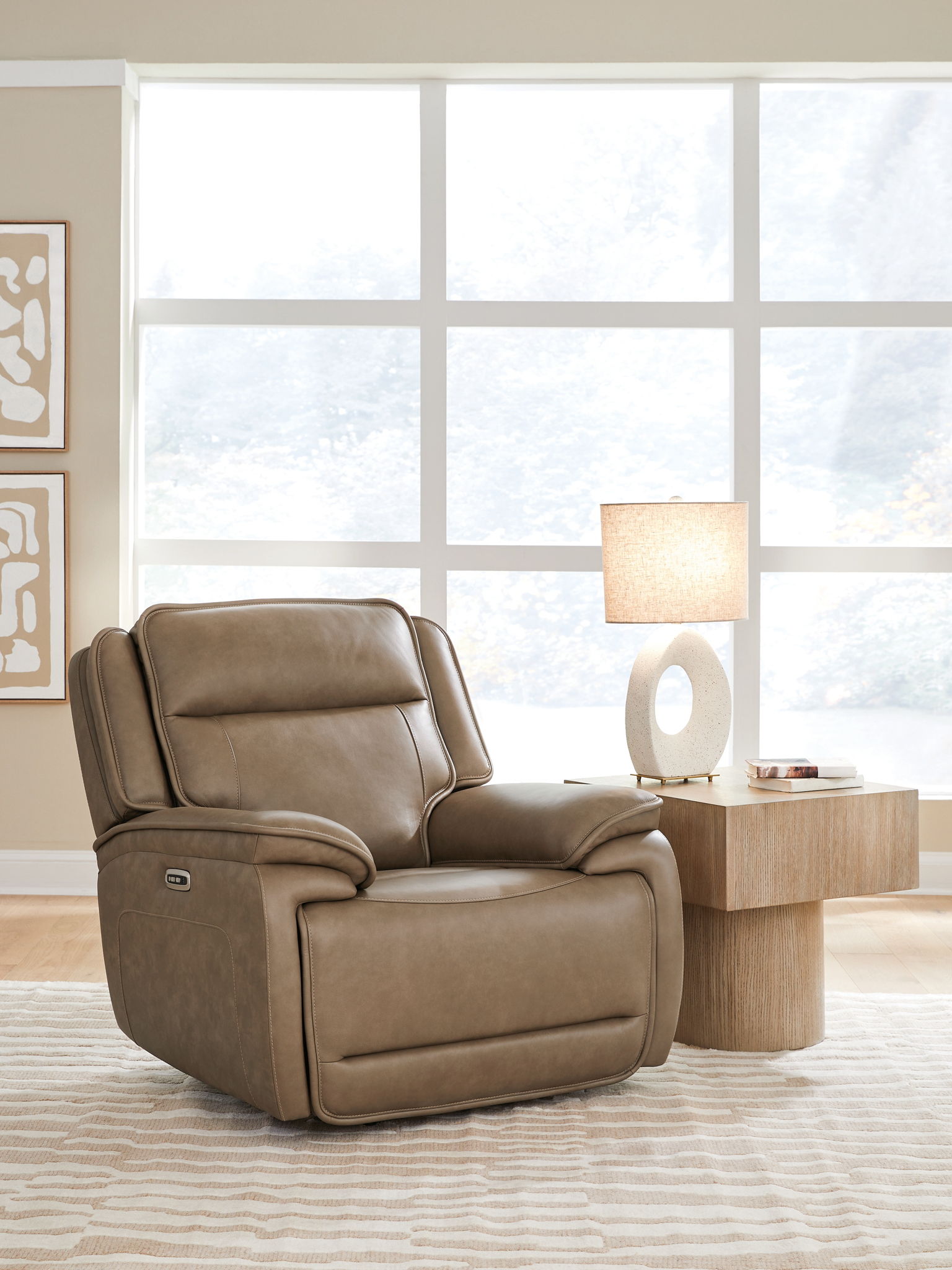 Brown power recliner chair with adjustable headrest and smooth recline design, angled view
