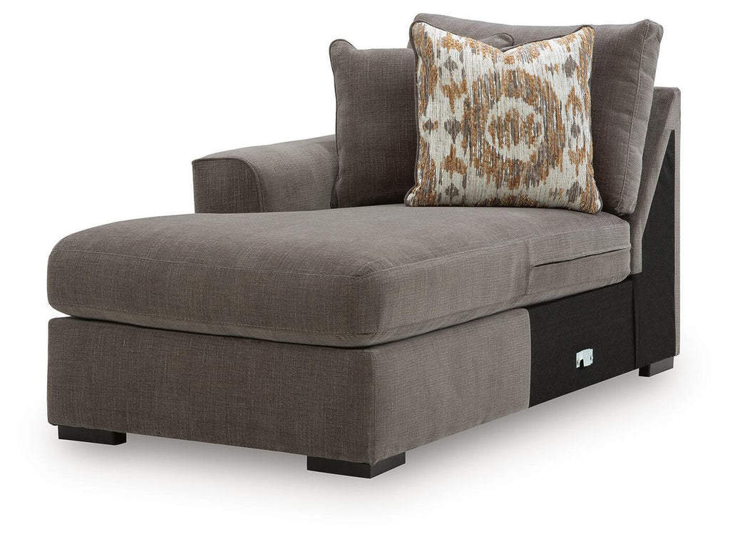 Dark brown corner chaise with padded seat and square arm, plus patterned accent pillow