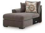 Dark brown corner chaise with padded seat and square arm, plus patterned accent pillow