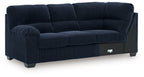 Navy upholstered LAF sofa with corner wedge, boxy cushions and track arms