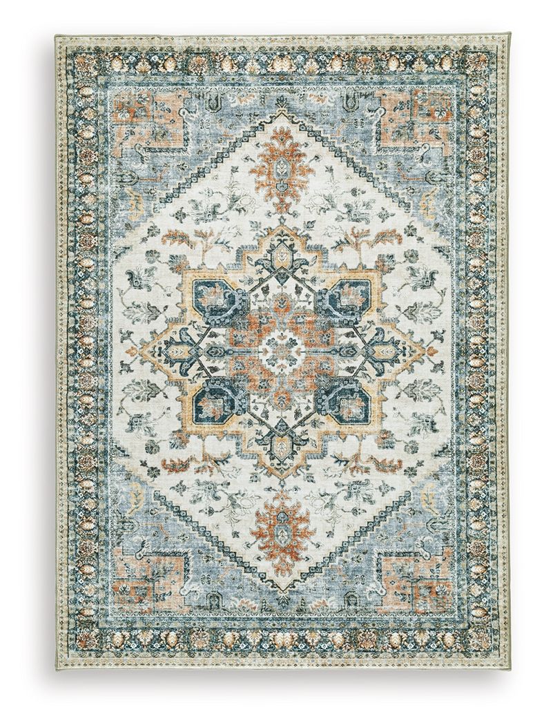 Wallney rug with distressed blue motifs on cream background, central medallion and border