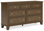 Medium brown wood dresser with three rows of drawers and silver knob hardware