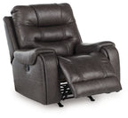 Smoke rocker recliner chair with extended footrest and dark gray upholstered arms