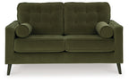 Olive green tufted loveseat with rolled arms, two seat cushions, and two bolster pillows.