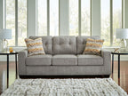 Larimer sofa in gray fabric with three seat cushions and two patterned throw pillows