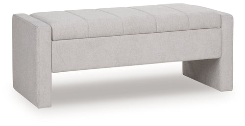 Gray storage bench with tufted upholstered top and hinged lid closed