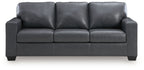 Dark gray leather sofa with three seat cushions and squared arm panels