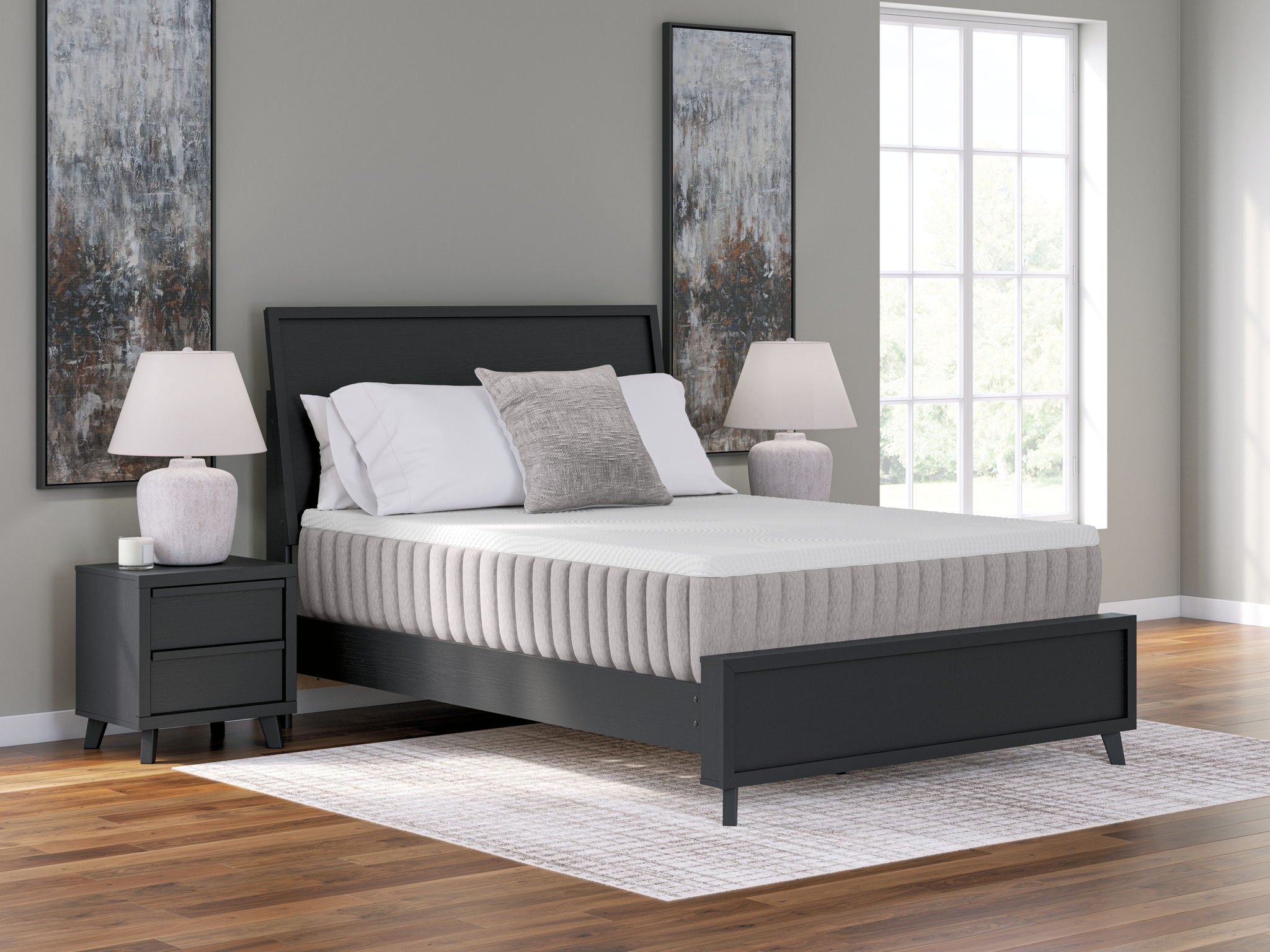 White mattress on dark platform bed, visible side channels and top surface