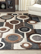 Geometric area rug with ring circle motif in charcoal, dark brown, and cream