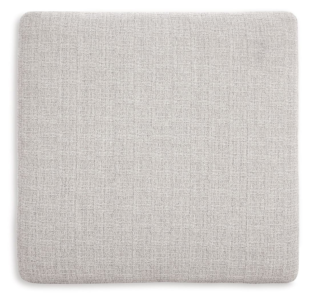 Stone upholstered ottoman top with textured weave and rounded edges