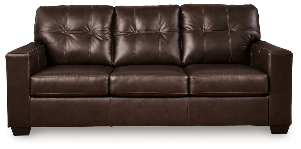 Dark brown leather sofa with tufted seat-back panels and three front cushions