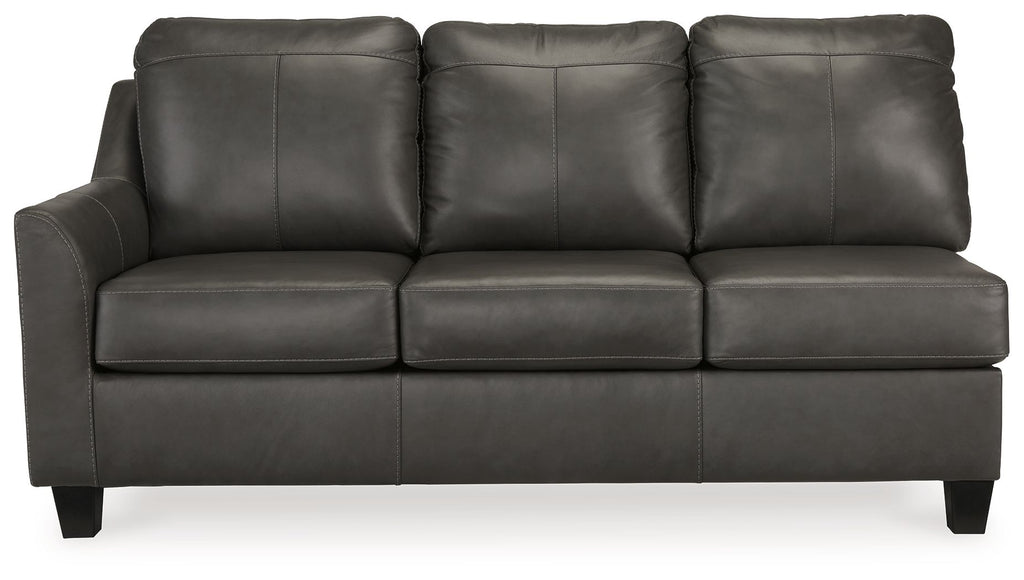 Dark gray leather sofa with three back cushions, three seat cushions, and square arms