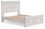 Light gray wood panel storage bed with slatted support and drawer footboard