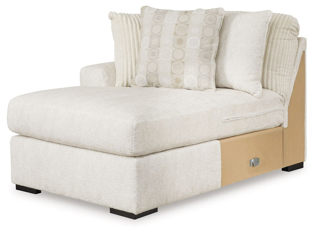 Ivory corner chaise bed with rolled arms, block legs, and two patterned pillows