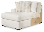 Ivory corner chaise bed with rolled arms, block legs, and two patterned pillows