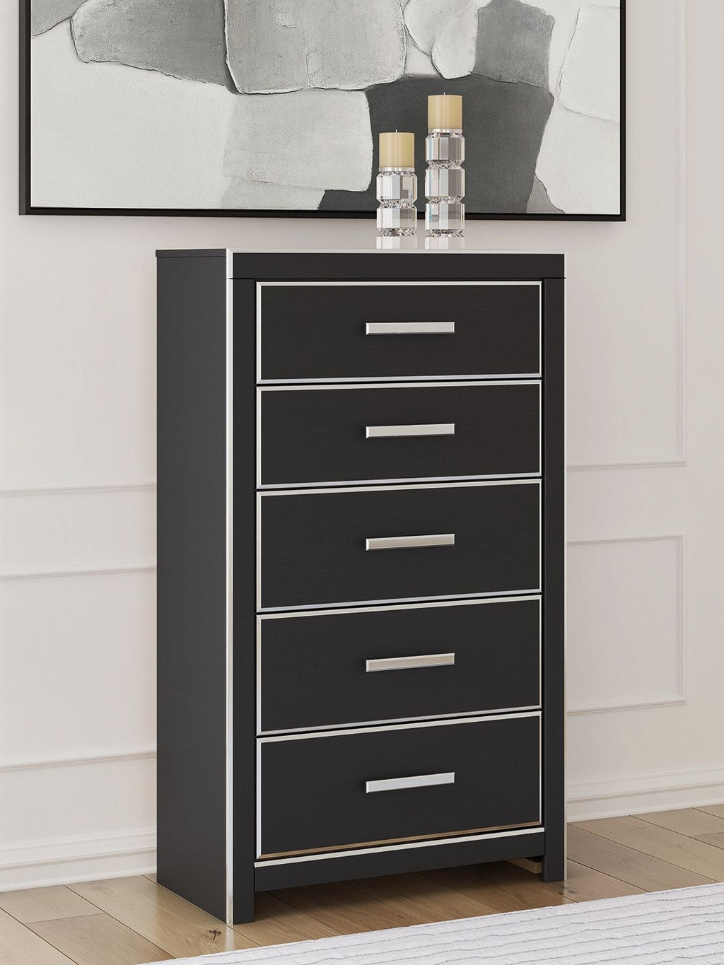 Black five-drawer chest with silver bar pulls on stacked drawers