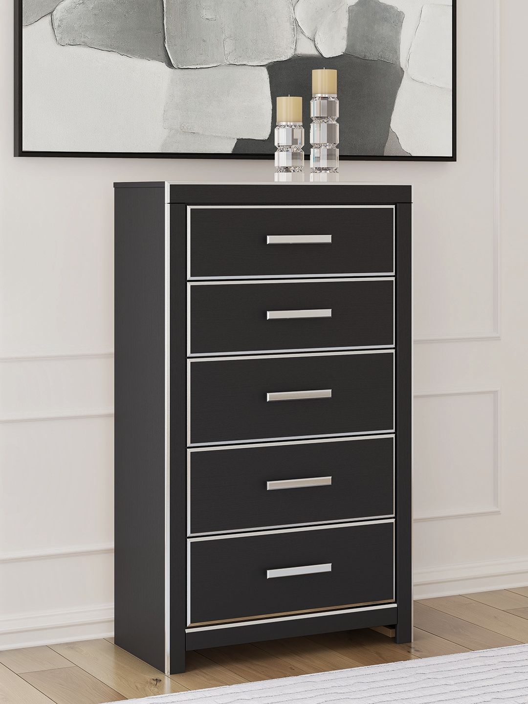 Black five-drawer chest with silver bar pulls on stacked drawers