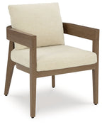 Arm chair with dark brown frame and beige seat and back cushions