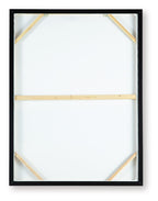 Framed wall art showing white backing and wooden corner supports