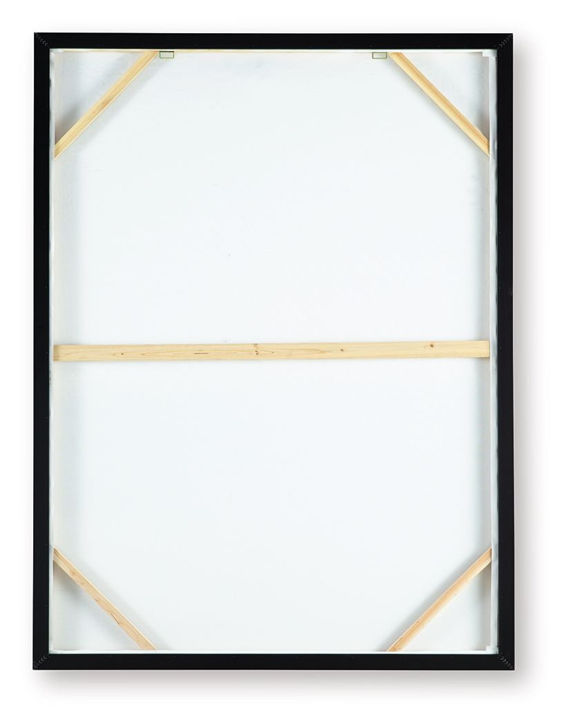 Framed wall art showing white backing and wooden corner supports