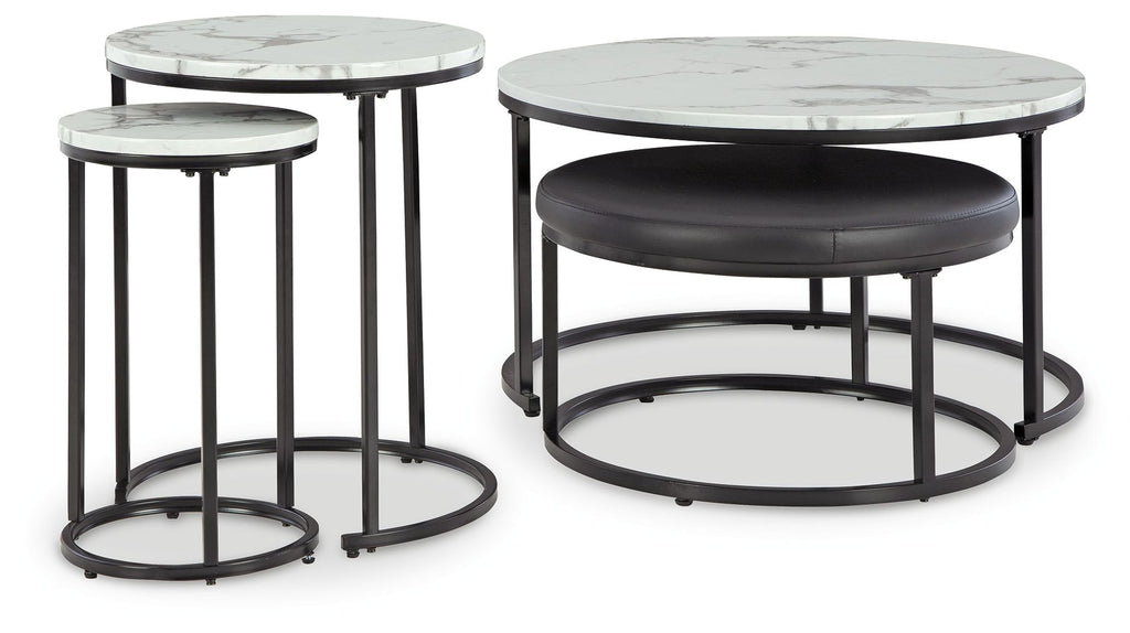 Round black metal nesting tables with white marble-look tops and cushioned bases