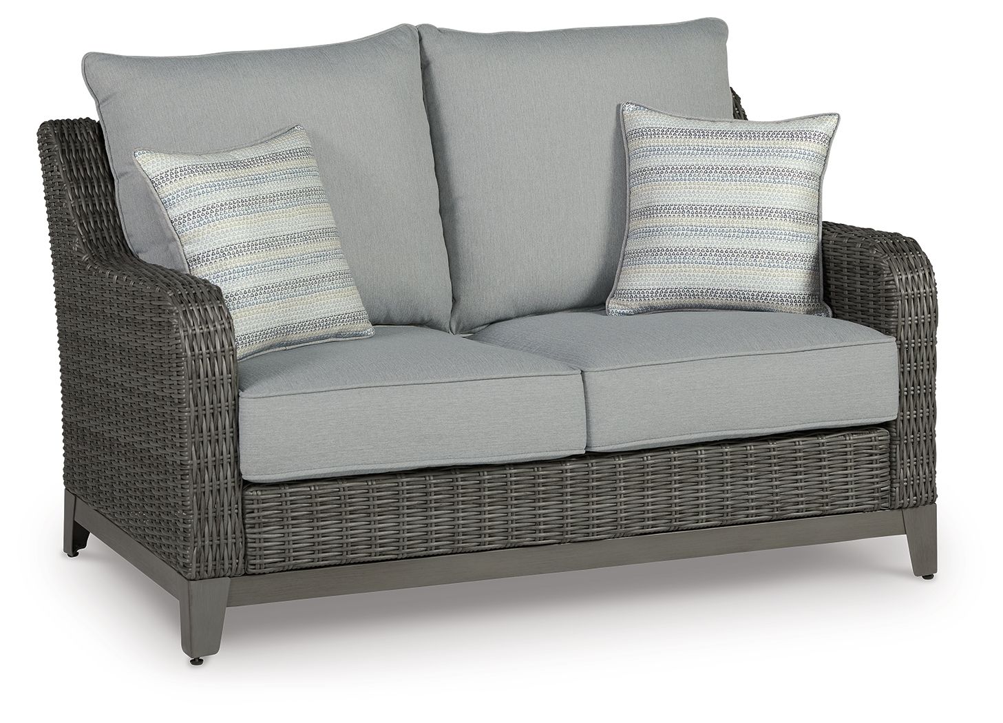 Gray wicker loveseat with two seat cushions, two back cushions, and striped pillows