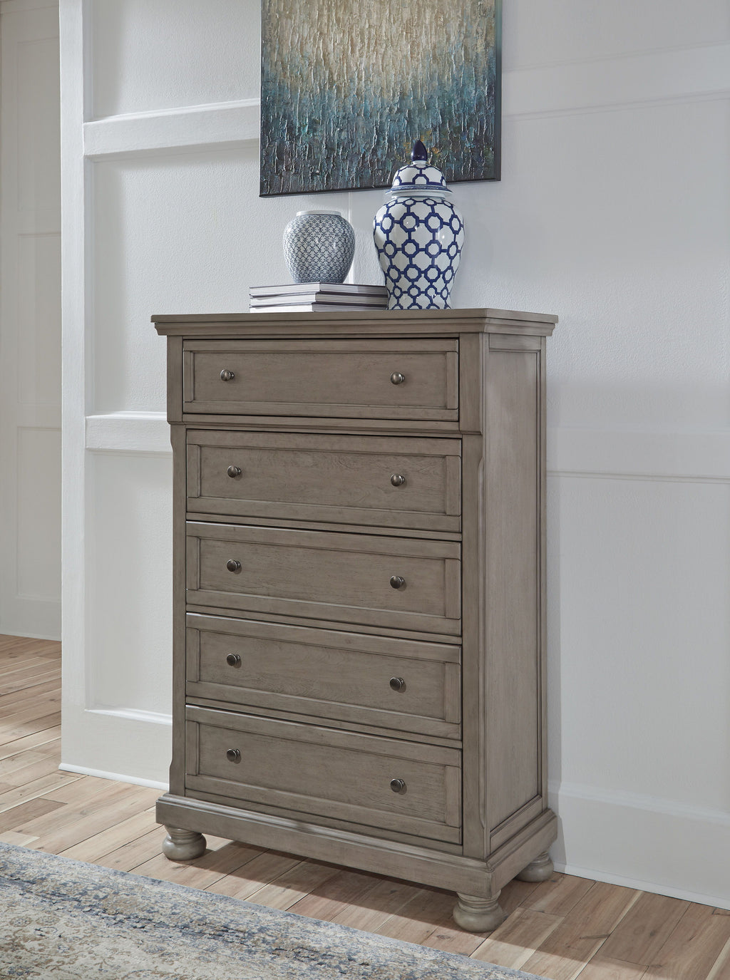 Wood dresser with multiple drawers and round metal pulls, bun feet