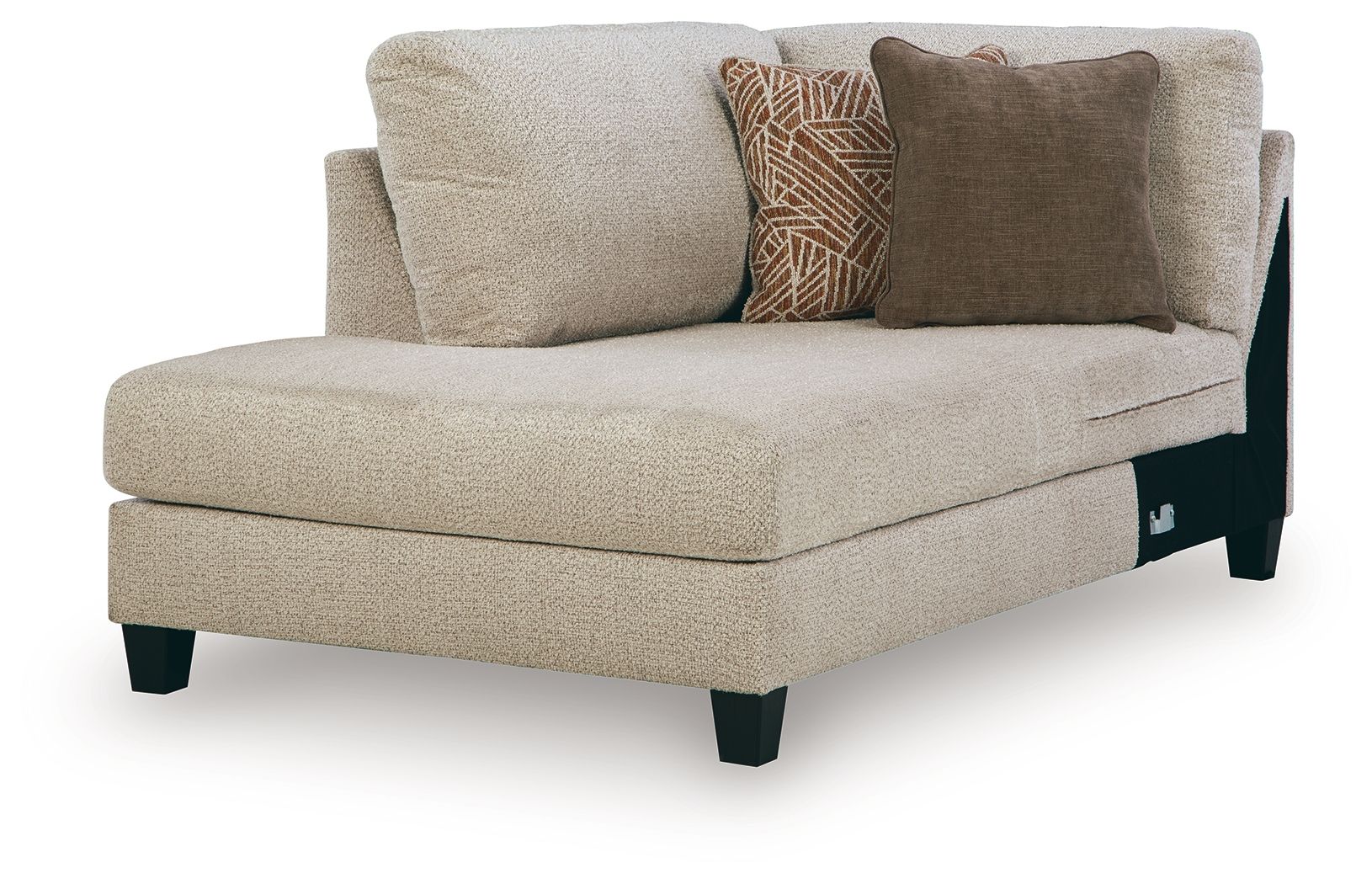 Latte corner chaise with beige upholstery and two accent pillows, dark legs