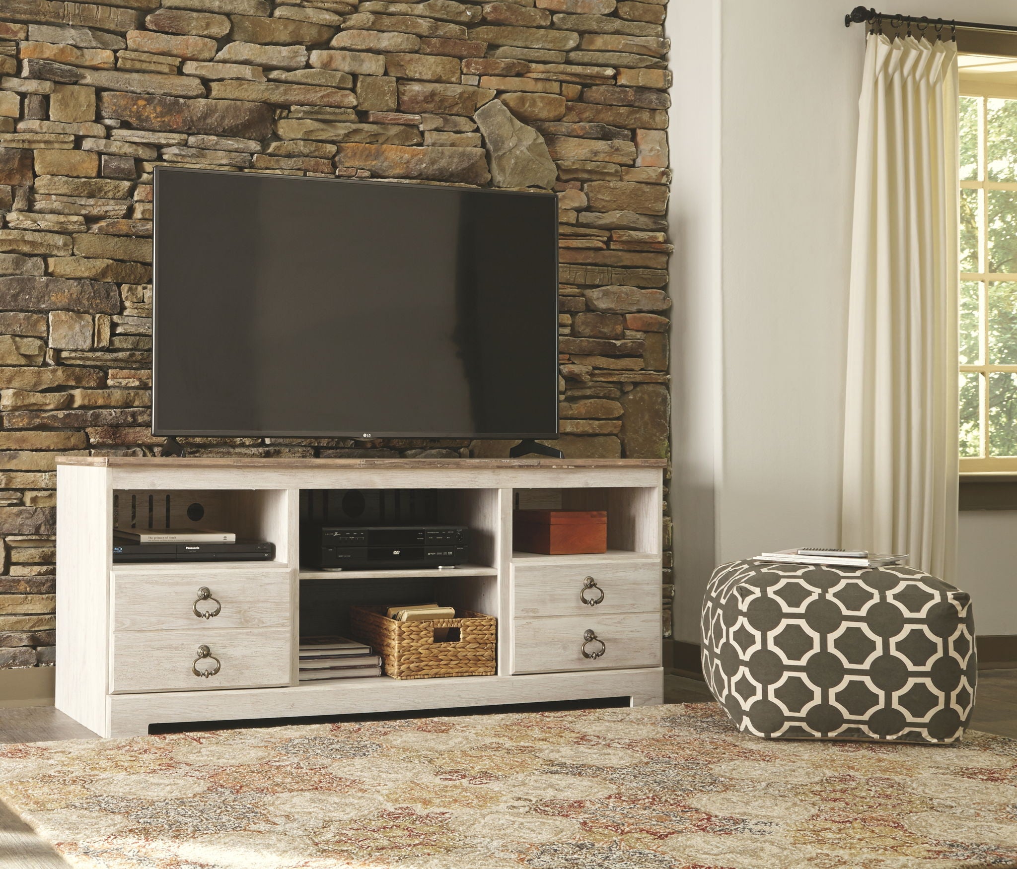 White entertainment center with electric fireplace insert and media shelves beneath TV