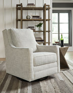 Light gray swivel accent chair with wide arms and thick seat cushion, black base