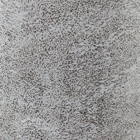 Textured speckled ceramic surface, light gray with darker dots and mottled finish.
