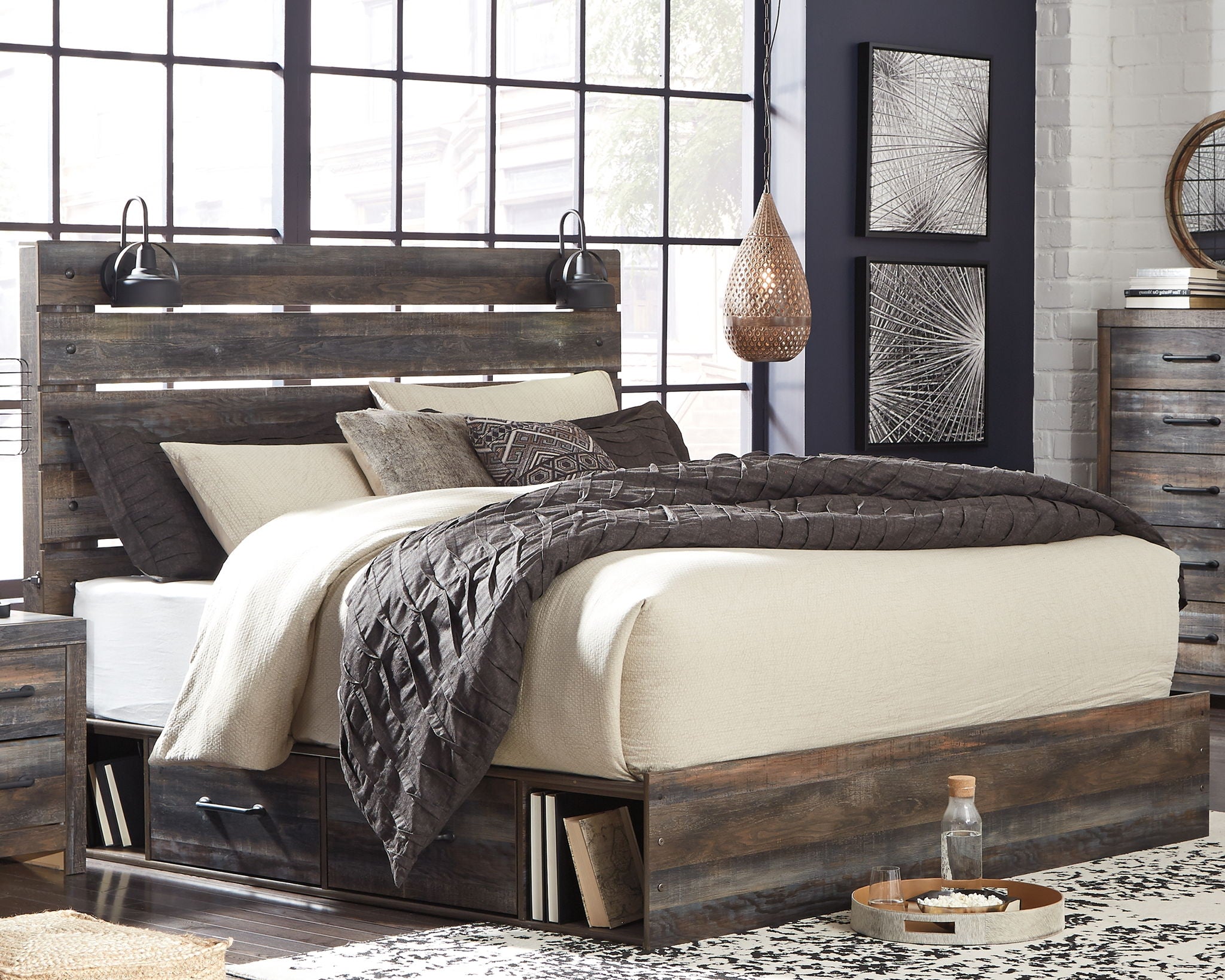 Dark wood panel bed with slatted headboard and side drawers, quilted bedding and pillows