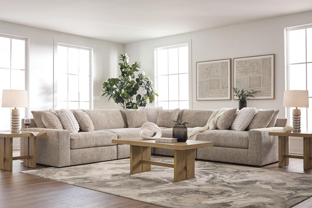Burlap-upholstered sectional sofa with chaise seats and three decorative throw pillows