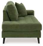 Green chaise lounge sofa with two tall back pillows and thick seat cushions
