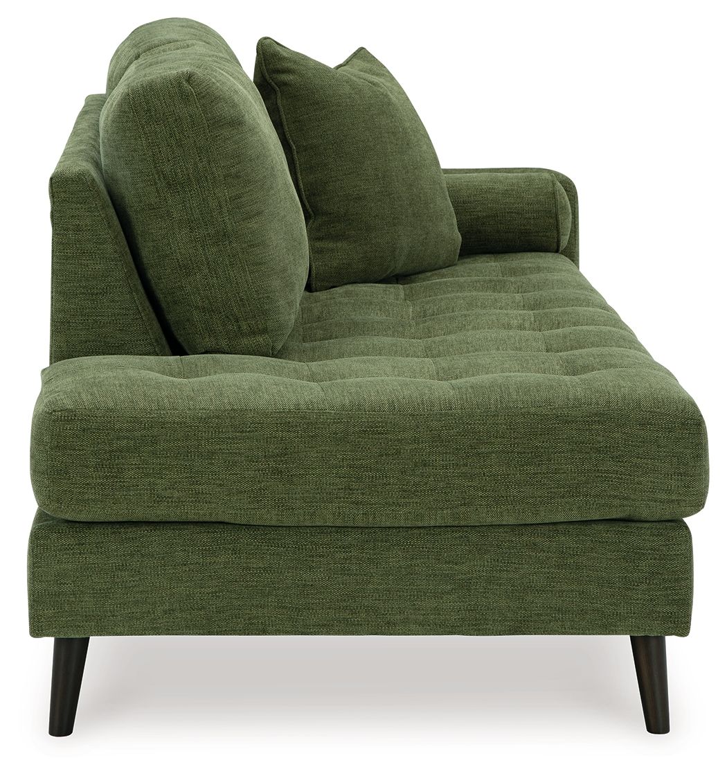 Green chaise lounge sofa with two tall back pillows and thick seat cushions