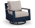 Swivel glider chair with beige cushion and blue armrests
