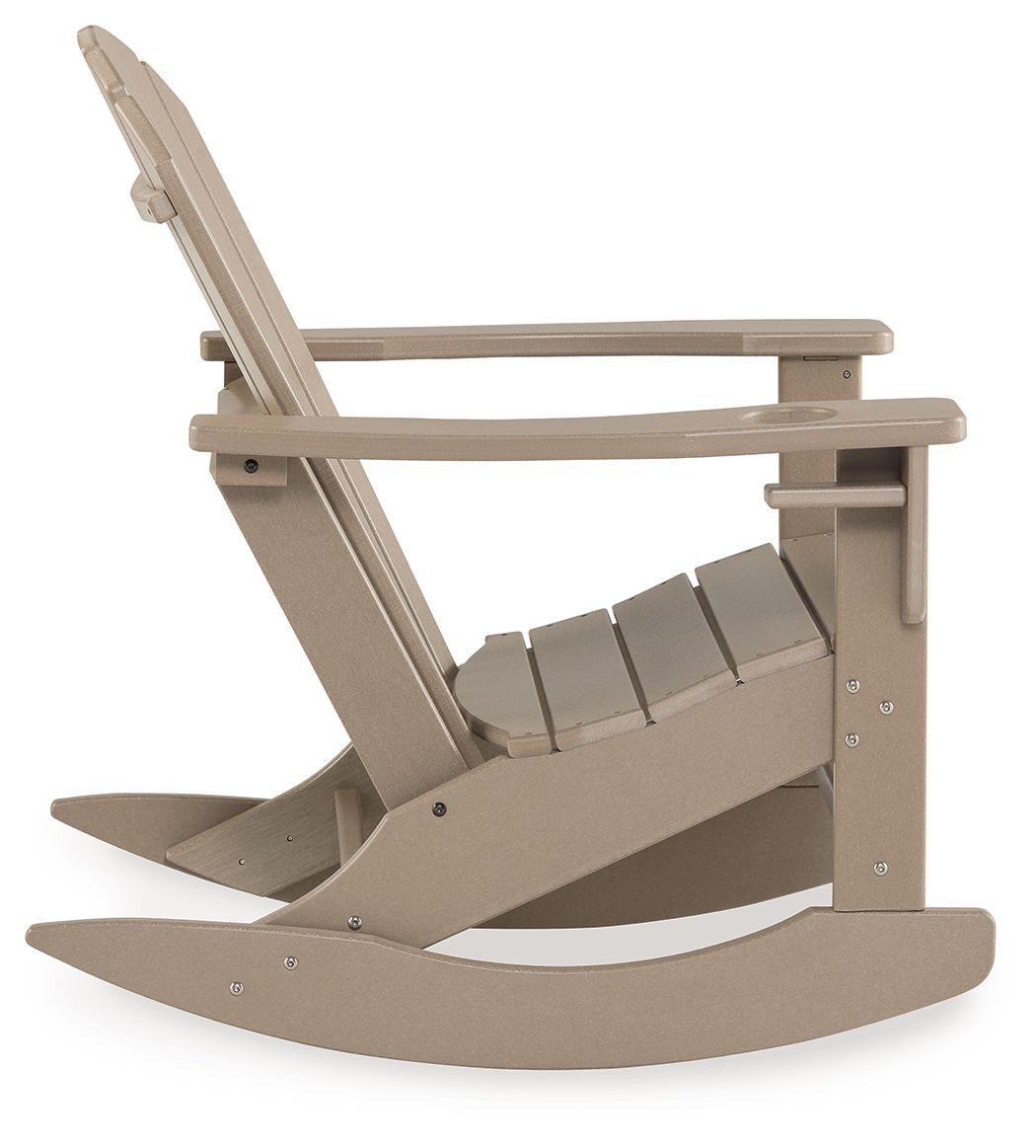 Light brown wooden rocking chair, slatted back and seat, wide curved base