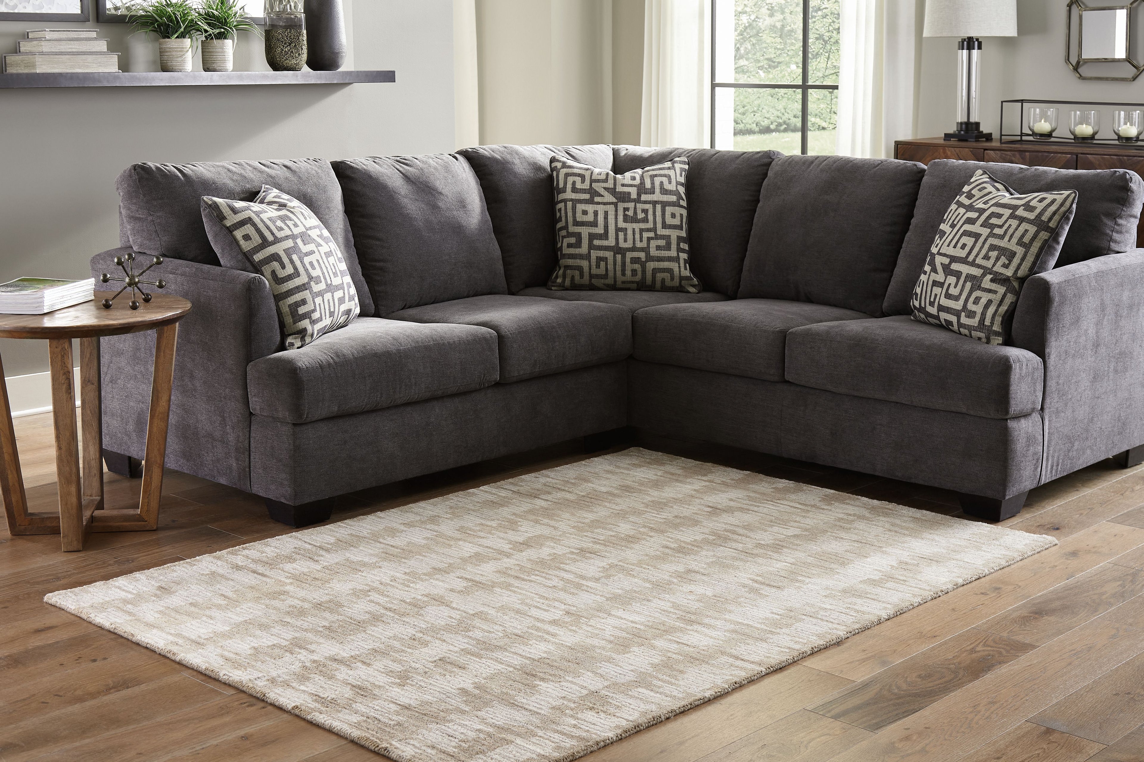 Light brown abstract area rug with low pile, flat woven finish, 5' x 7'