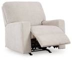 Rocker recliner chair in light beige with hinged footrest and padded armrests