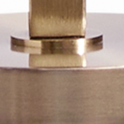 Gold metal lamp stem top with circular collar and flat base plate.