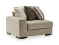 Corner chair with light beige linen-look upholstery and square arms; includes patterned throw pillows