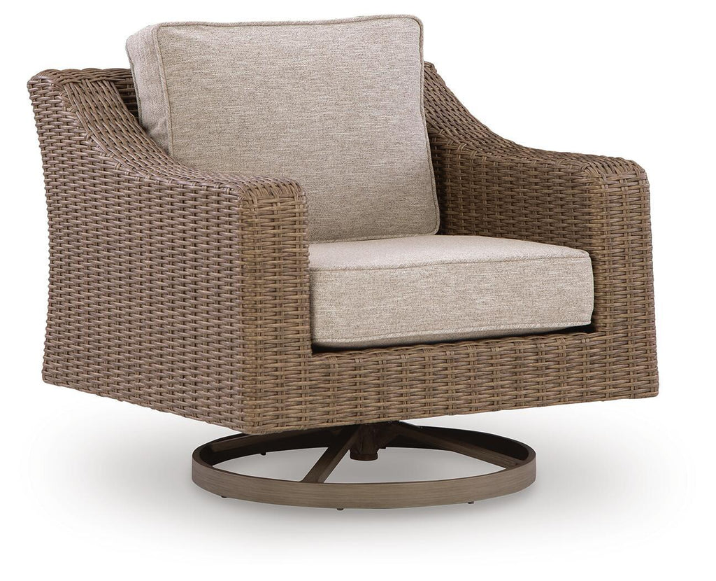 Beige cushion swivel lounge chair with woven wicker frame and round dark swivel base