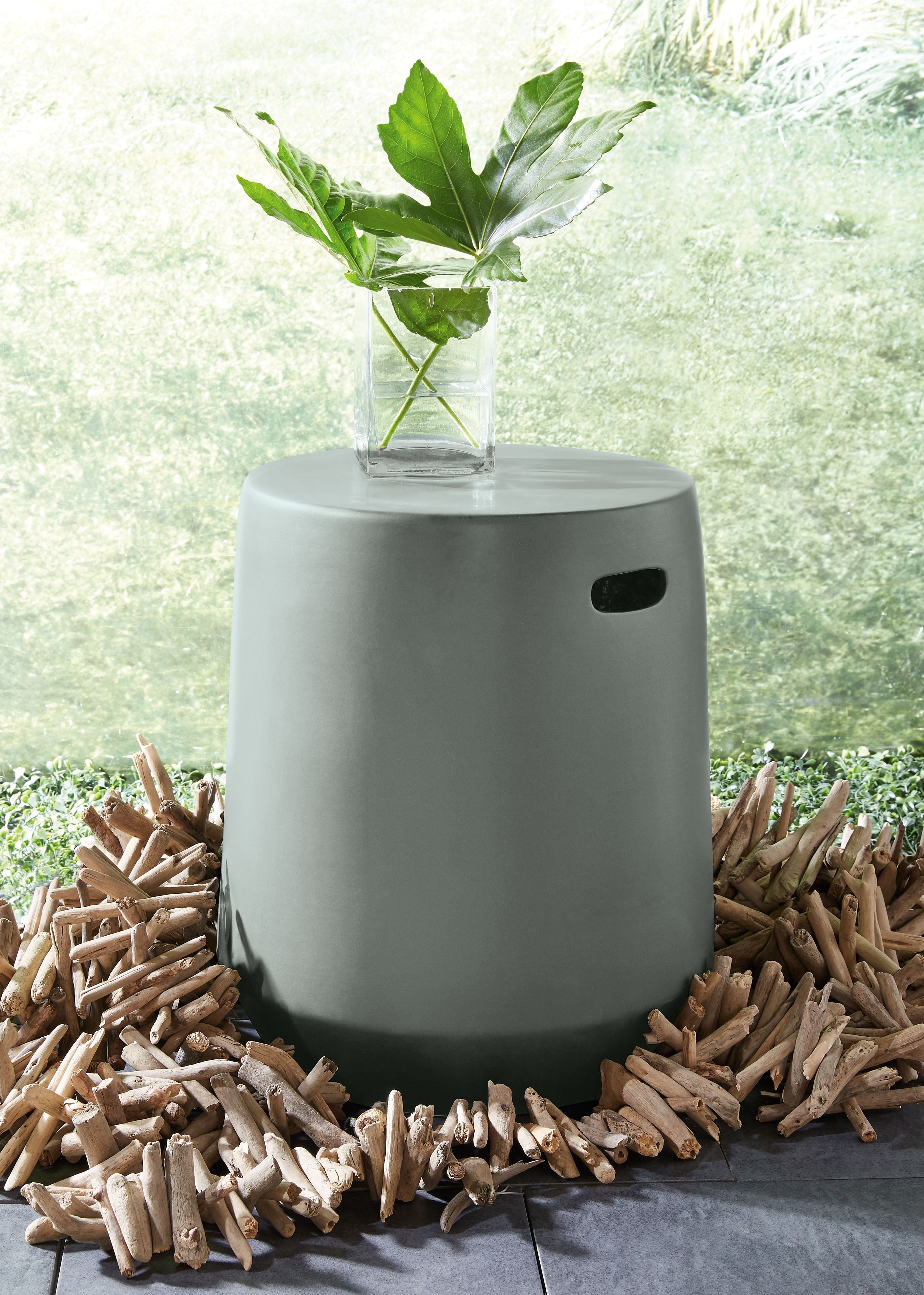 Gray cylindrical stool with oval handle cutout and flat top