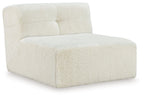 Ivory accent chair with textured boucle upholstery, wide arms, and cushioned backrest