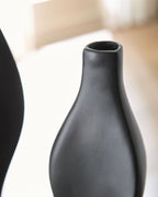 Black Judsen vase close-up with smooth matte texture and open top rim.