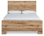 Light beige panel bed with horizontal headboard and white pillows on mattress