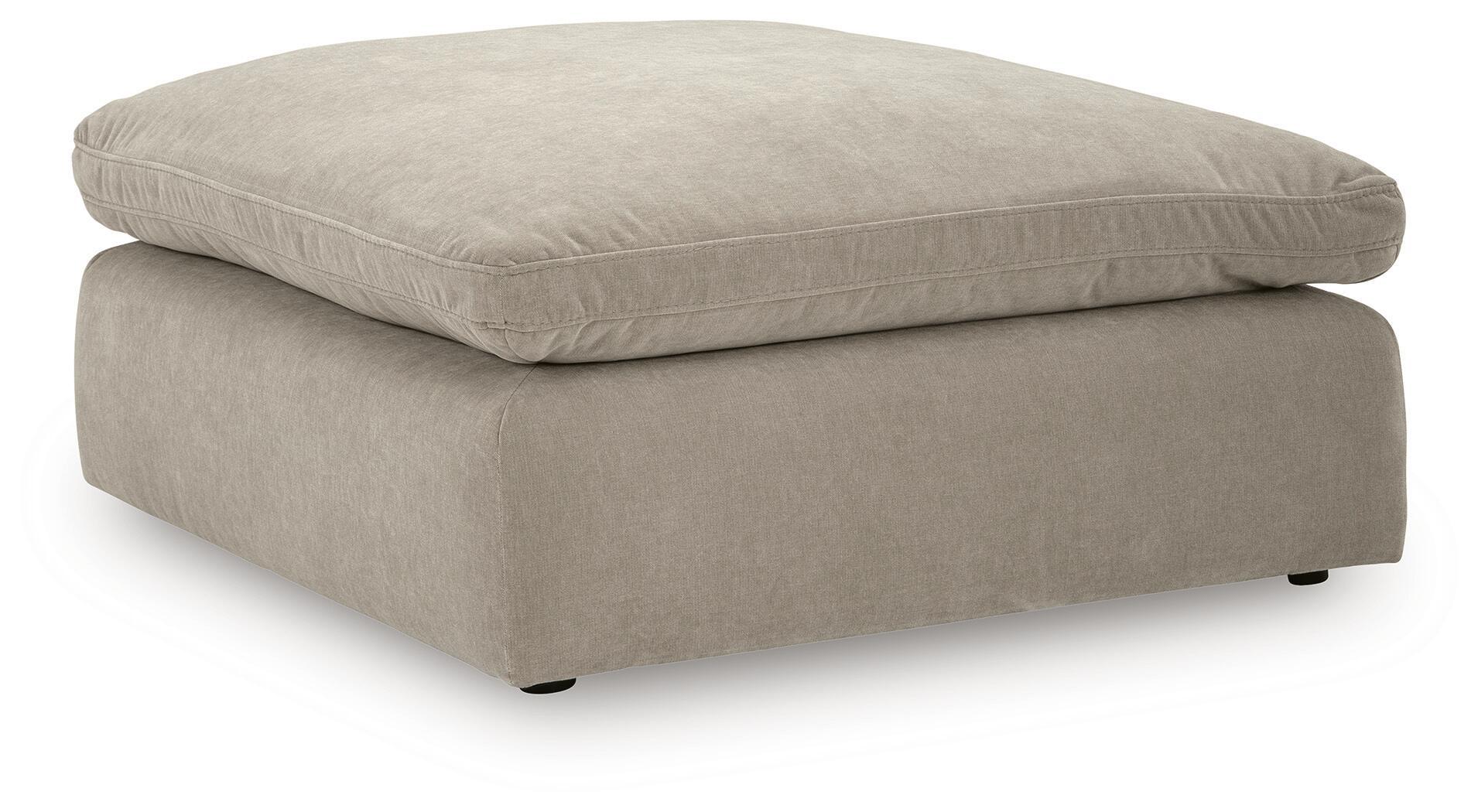 Oversized accent ottoman in light gray, padded top cushion and simple low base