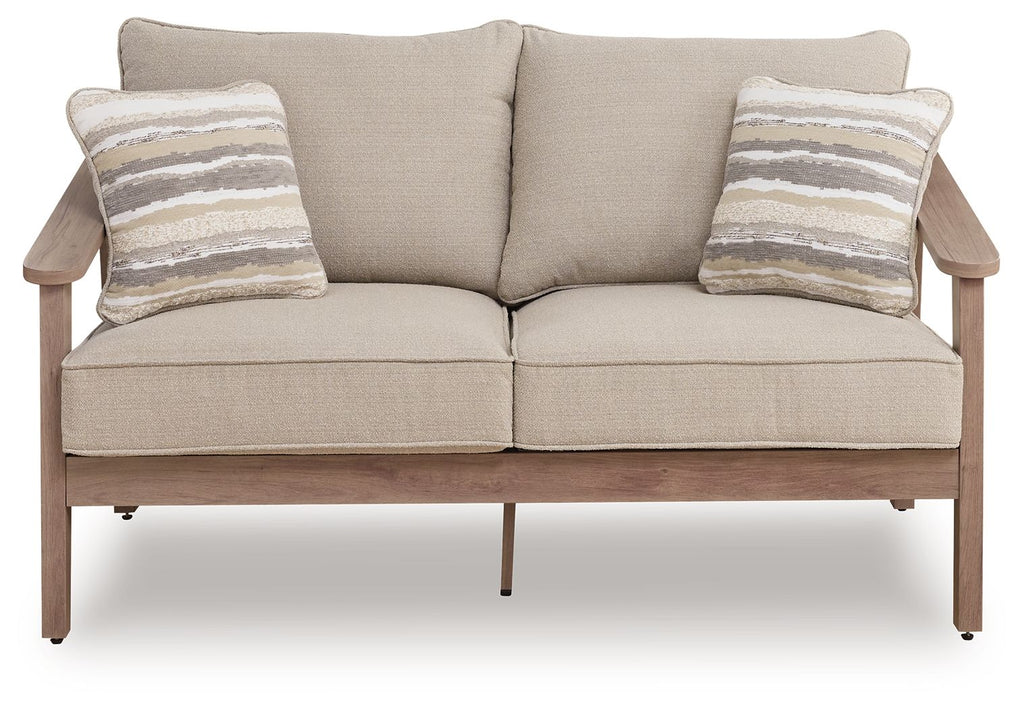 Beige loveseat with cushion, two striped throw pillows, centered seat cushions, wood frame